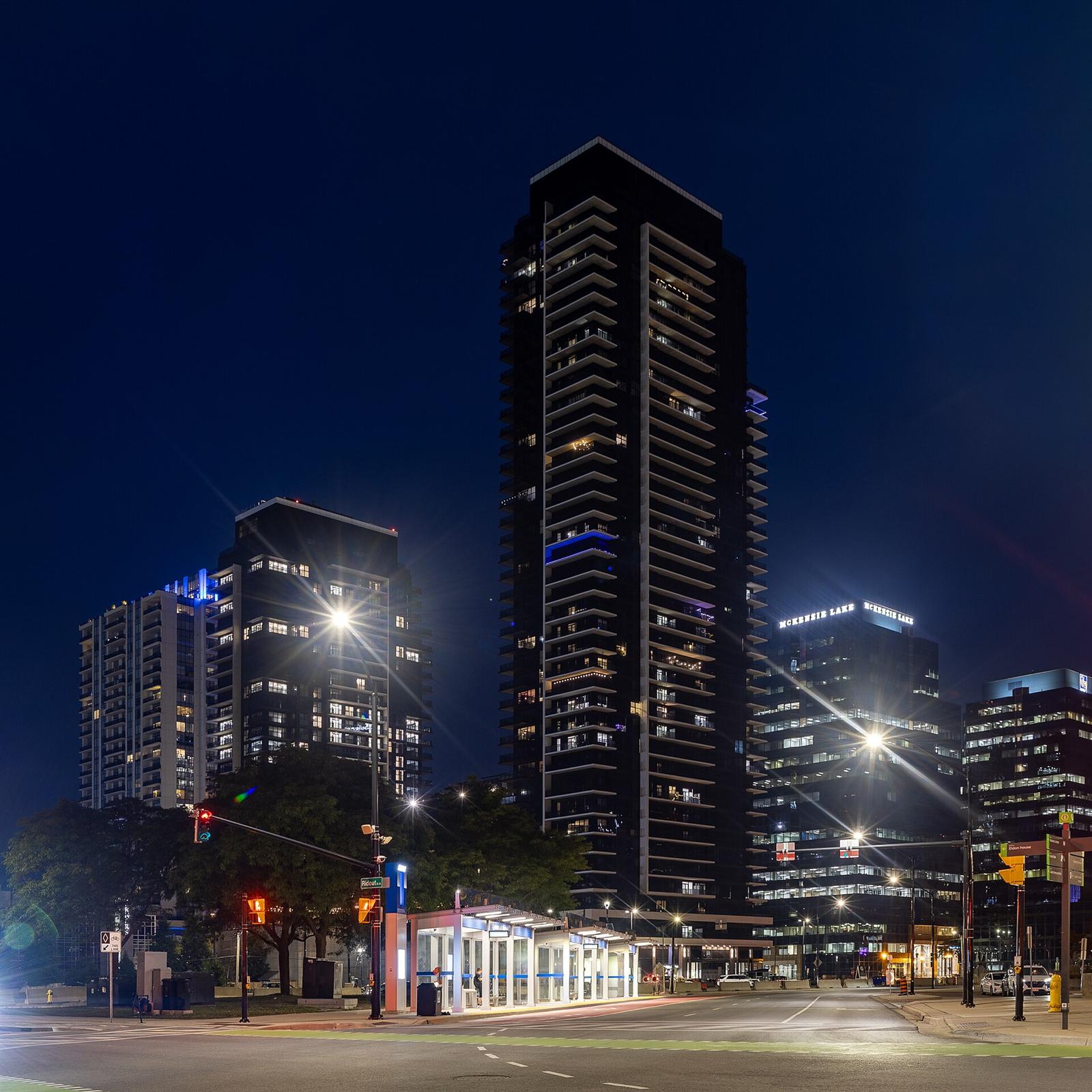Downtown London, Ontario towers and a bus shelter at night