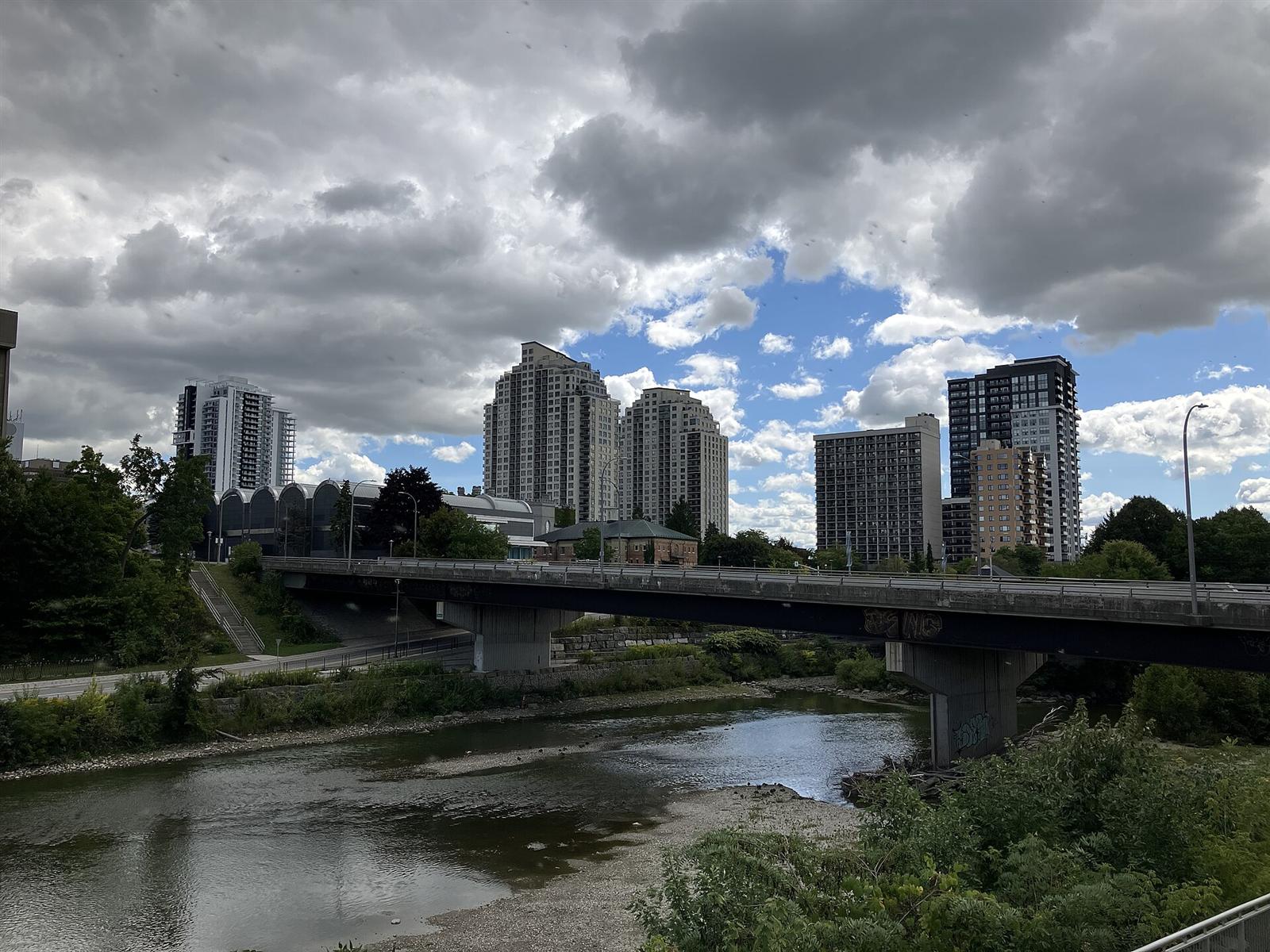 Downtown London, Ontario seen across the Thames River under a cloudy sky